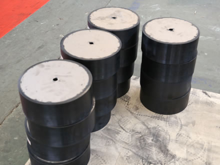 Many pieces of elastomeric pad for making the high damping rubber bearings are placed together.